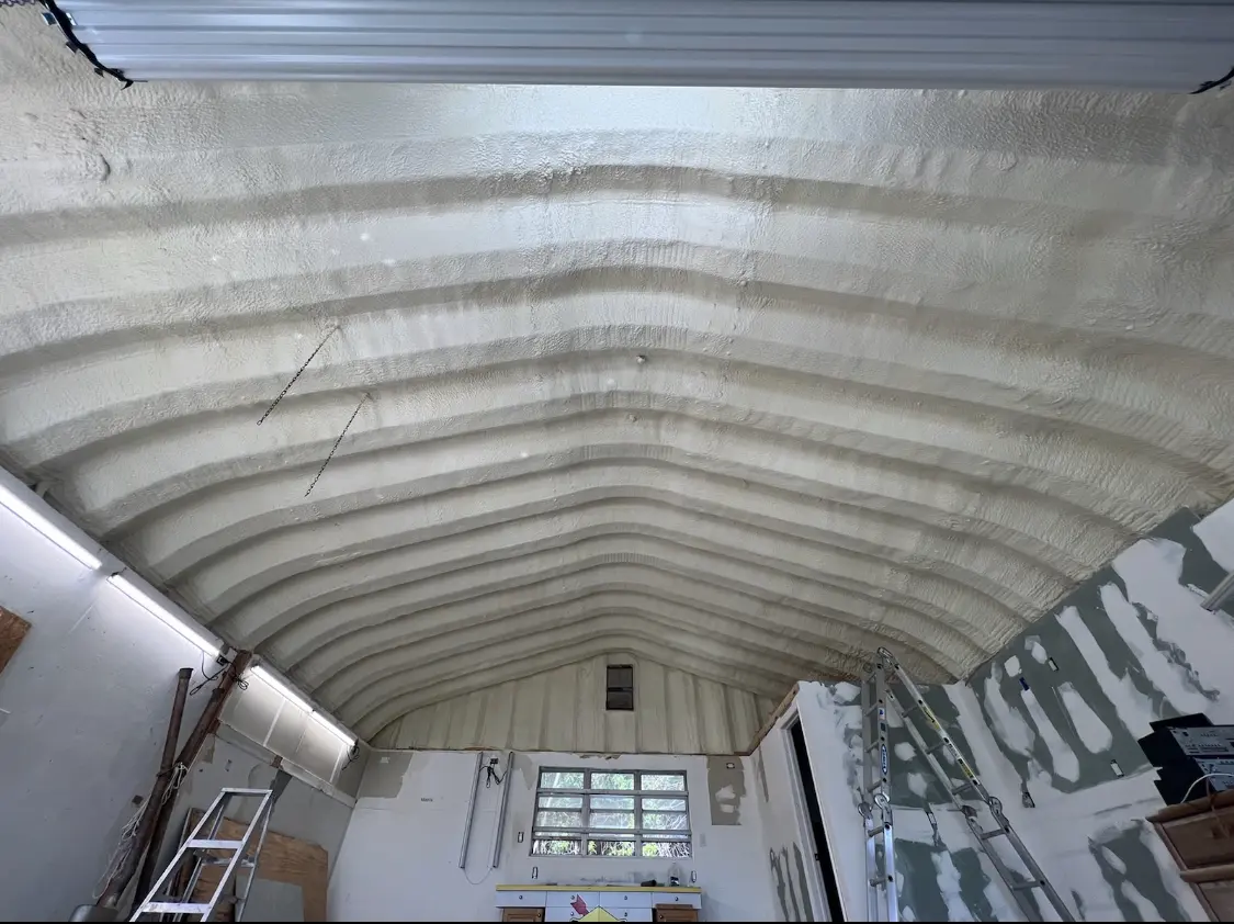 Spray polyurethane foam applied to the underside of a metal roof deck in Hartford